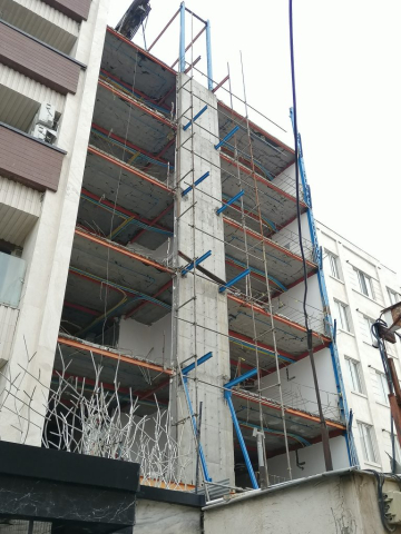 تصویری از نمای بیرونی ساختمان در حال اجرای والپست